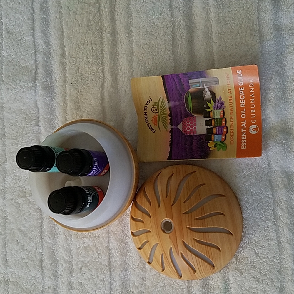 Diffuser With essential oil recipe book.